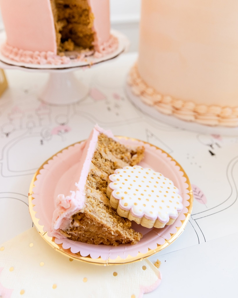 Pink and gold dessert plate with a slice of cake and cookie princess birthday from Parte Haus party supply store in Bethesda MD