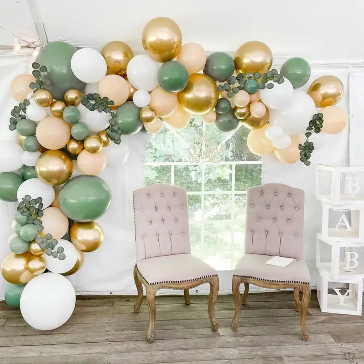 Sage gold and white balloon garland arch with greenery baby shower theme from Parte Haus party supply store in Bethesda MD