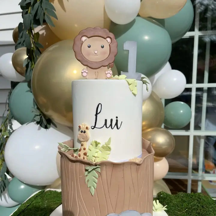 sage gold and white balloon garland with safari animals for first birthday from Parte Haus party supply store in Bethesda MD