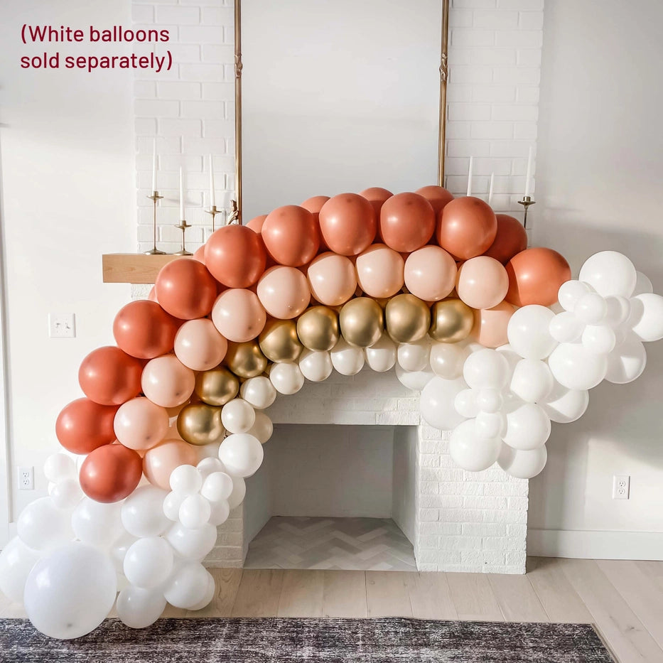 Burnt orange balloon arch kit with gold and nude balloons for boho event from Parte Haus party supply store in Bethesda, Maryland