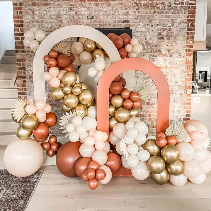 Burnt orange and gold balloon arch kit with boho style for birthday from Parte Haus party supply store in Bethesda MD