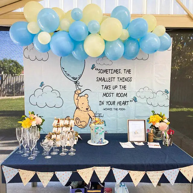 Blue and yellow teddy bear balloon arch kit with garland and Winnie the Pooh baby shower theme from Parte Haus party supply store in Bethesda Maryland