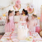 Pink princess party hats with gold trim and girls at birthday celebration from Parte Haus party supply store in Bethesda MD
