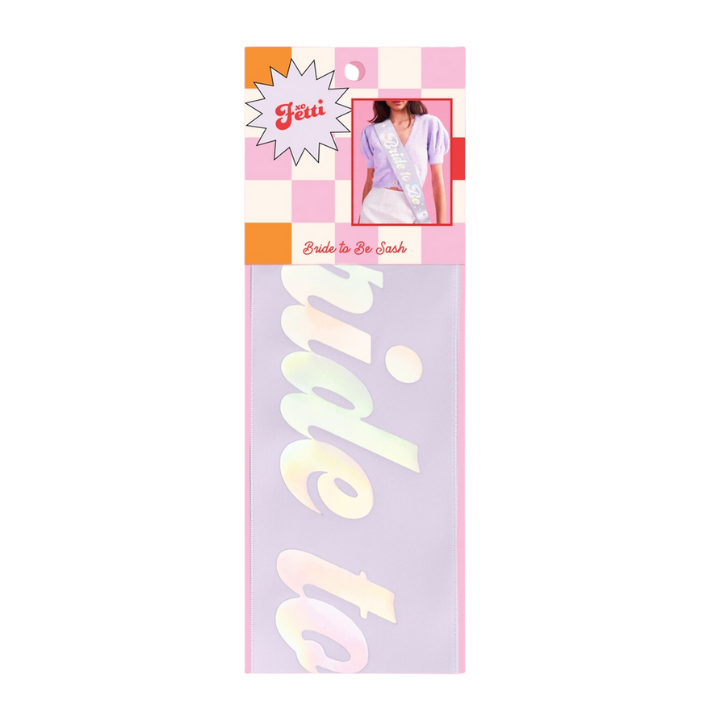 Iridescent bride to be sash with bold script for bridal shower from Parte Haus party supply store in Bethesda Maryland