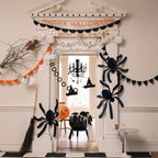 Black and orange Halloween decorations with spiders and garlands Halloween theme from Parte Haus party supply store in Bethesda MD