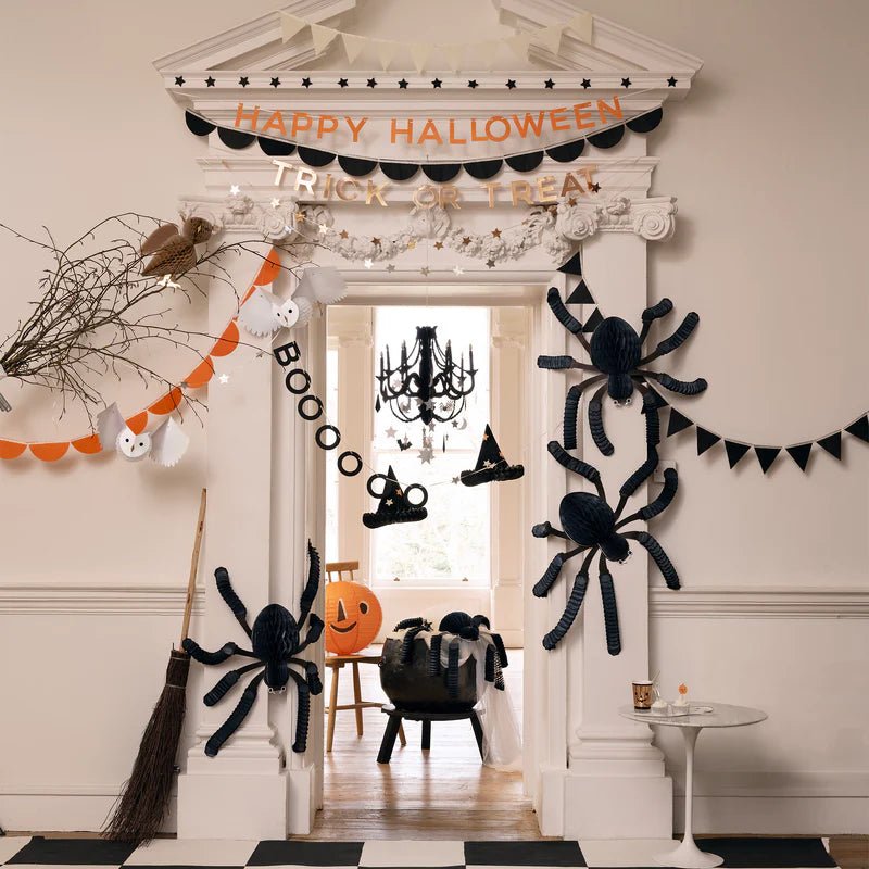 Black and orange Halloween decorations with spiders and garlands Halloween theme from Parte Haus party supply store in Bethesda MD