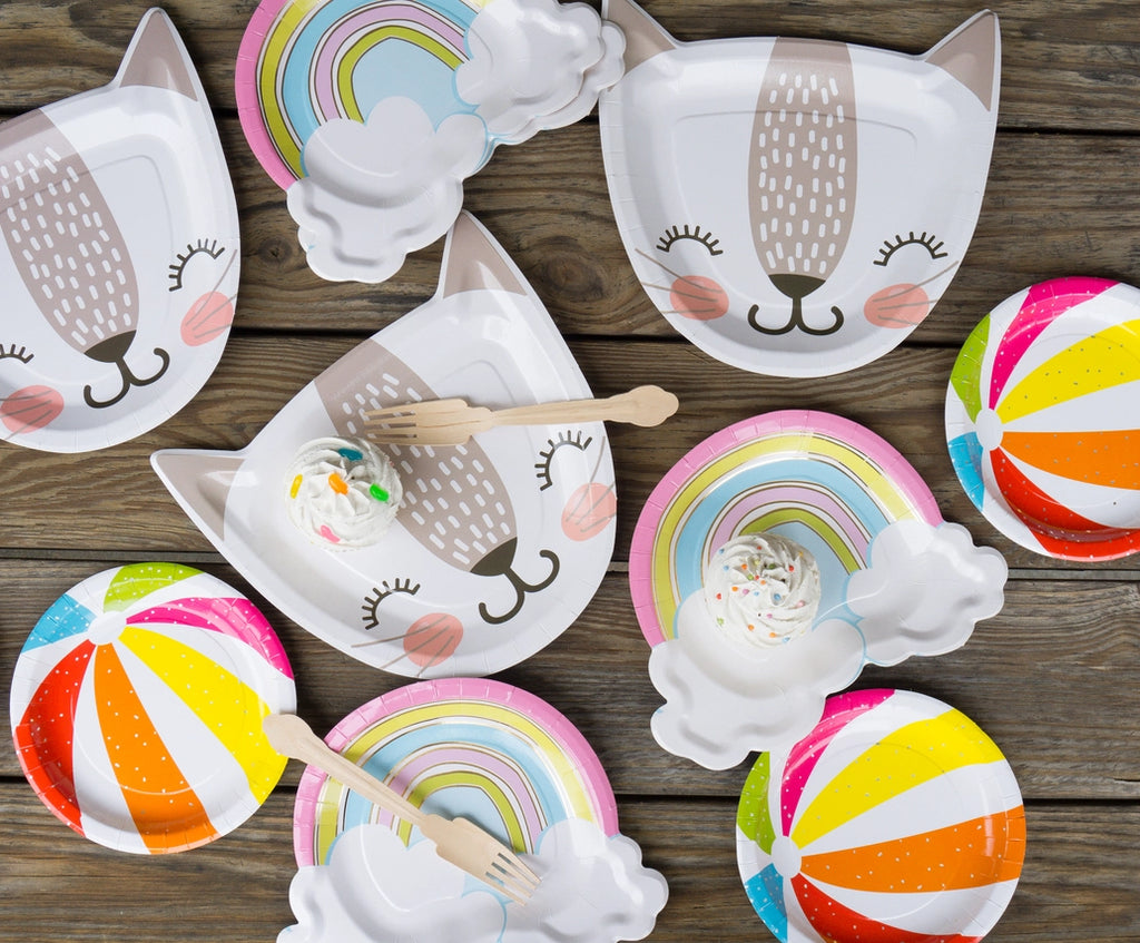 Rainbow dessert plates with pastel rainbows clouds and colorful beach ball plates for birthday from Parte Haus party supply store in Bethesda MD