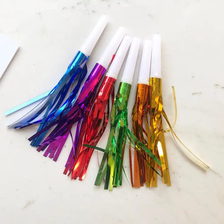 Rainbow color party whistles with shiny fringe for birthday celebration from Parte Haus party supply store in Bethesda MD