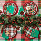 Red and green plaid plate set with gold cutlery and pine decor Christmas from Parte Haus party supply store in Bethesda MD