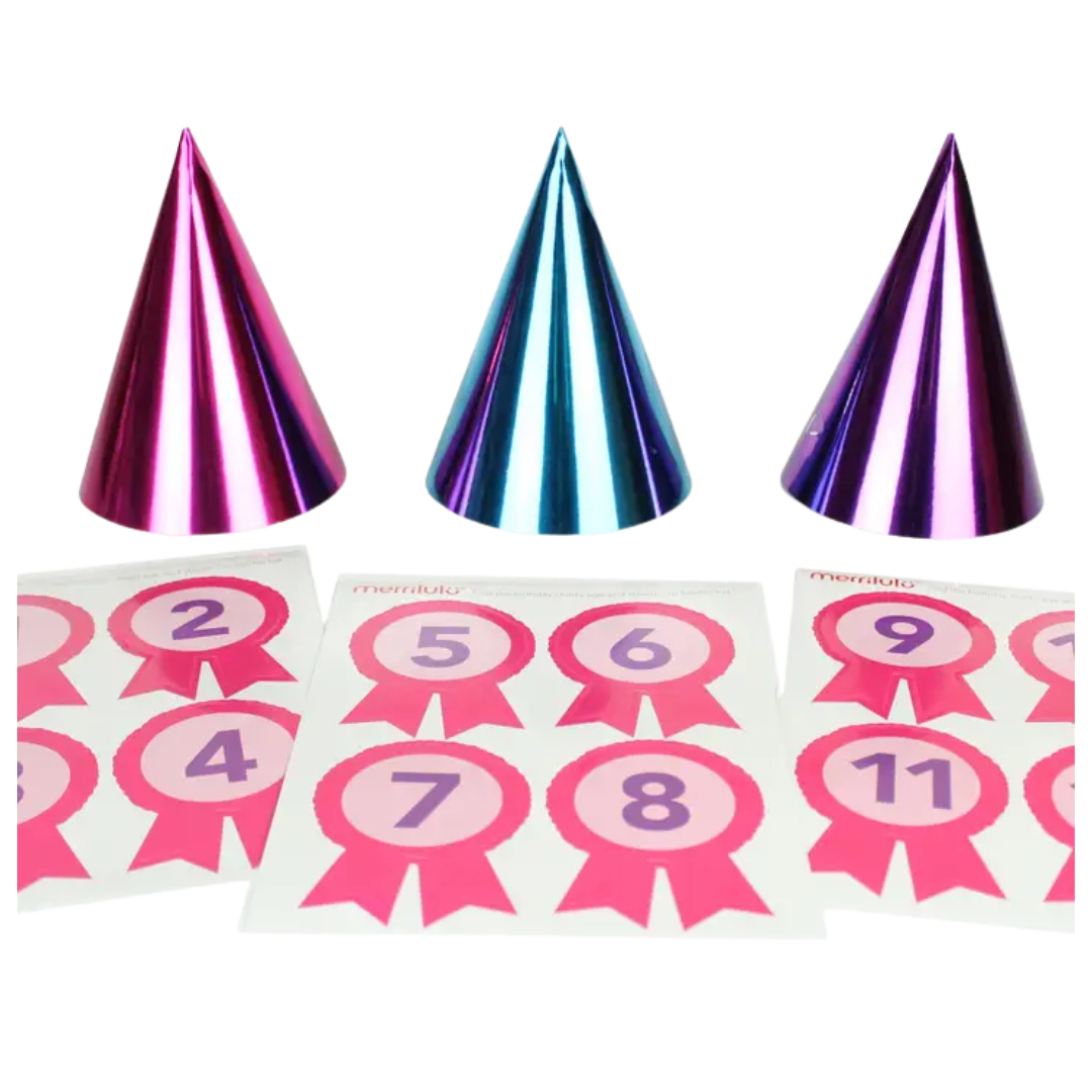 Metallic pink and blue cone hats with pink number stickers for birthday from Parte Haus party supply store in Bethesda Maryland