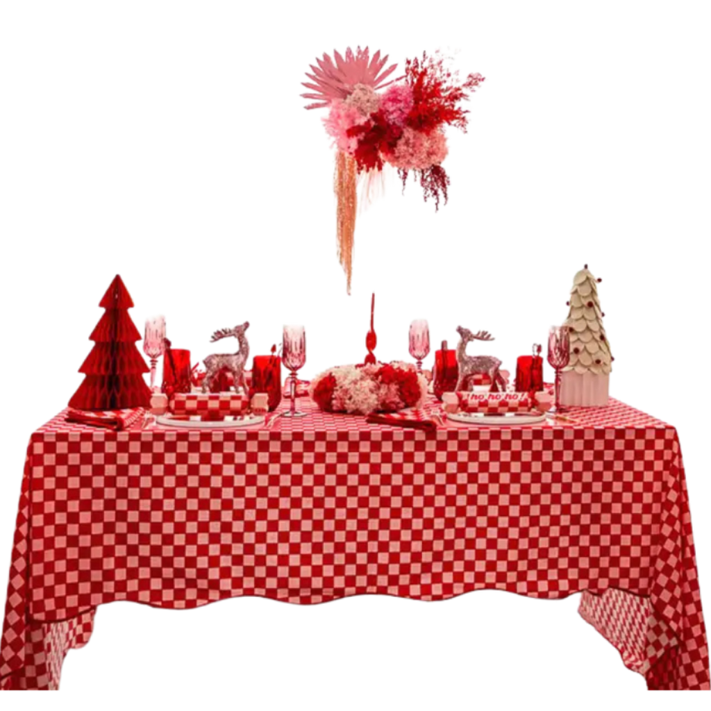 Red and white holiday table decor with checkered tablecloth and floral centerpiece Christmas theme from Parte Haus party supply store in Bethesda Maryland