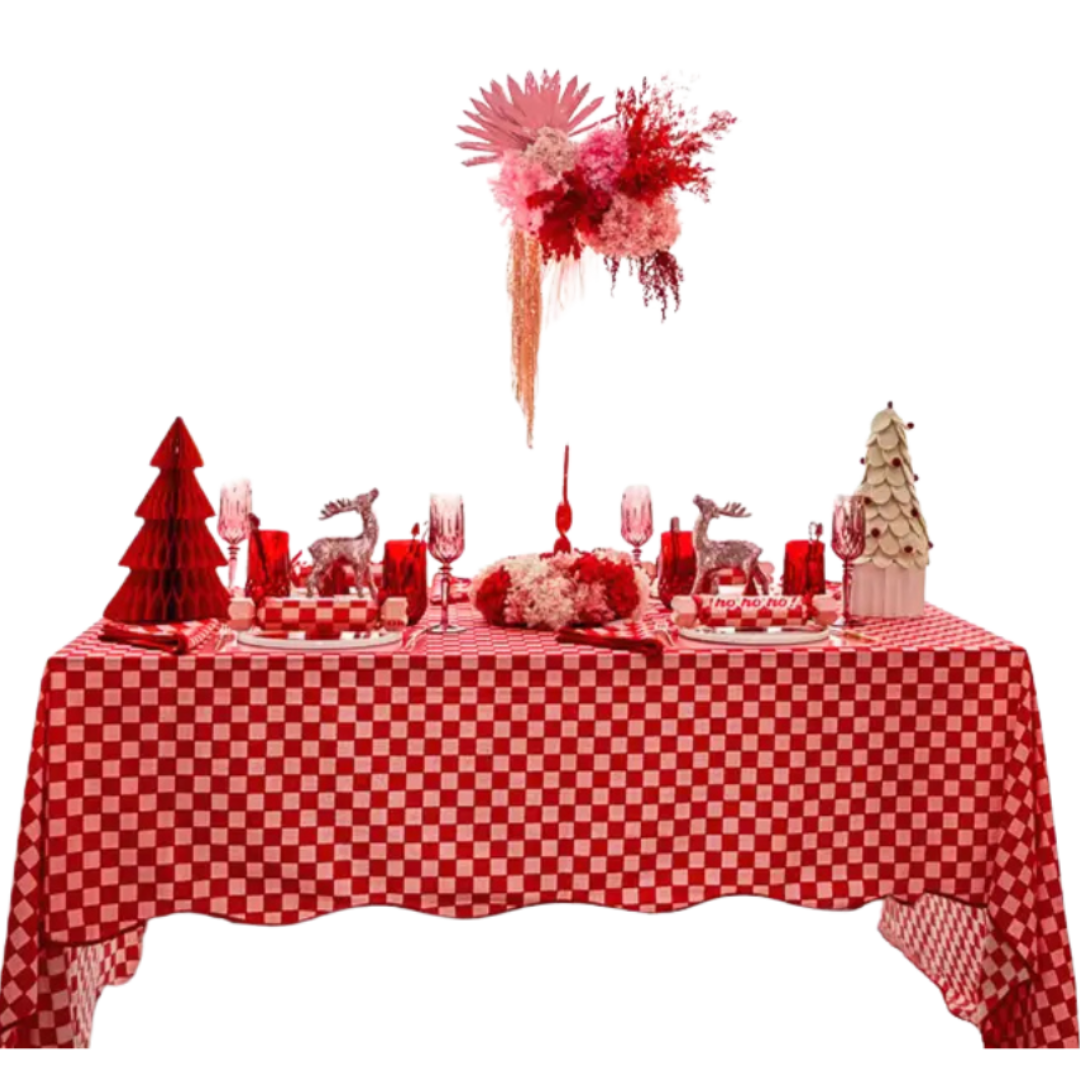Red and white holiday table decor with checkered tablecloth and floral centerpiece Christmas theme from Parte Haus party supply store in Bethesda Maryland