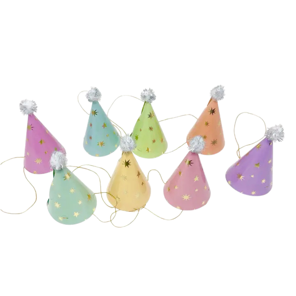 Pastel cone birthday hats with star patterns and pom poms for birthday celebration from Parte Haus party supply store in Bethesda Maryland