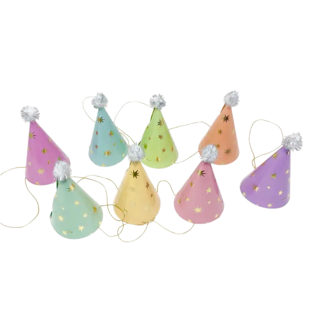 Pastel cone birthday hats with star patterns and pom poms for birthday celebration from Parte Haus party supply store in Bethesda Maryland