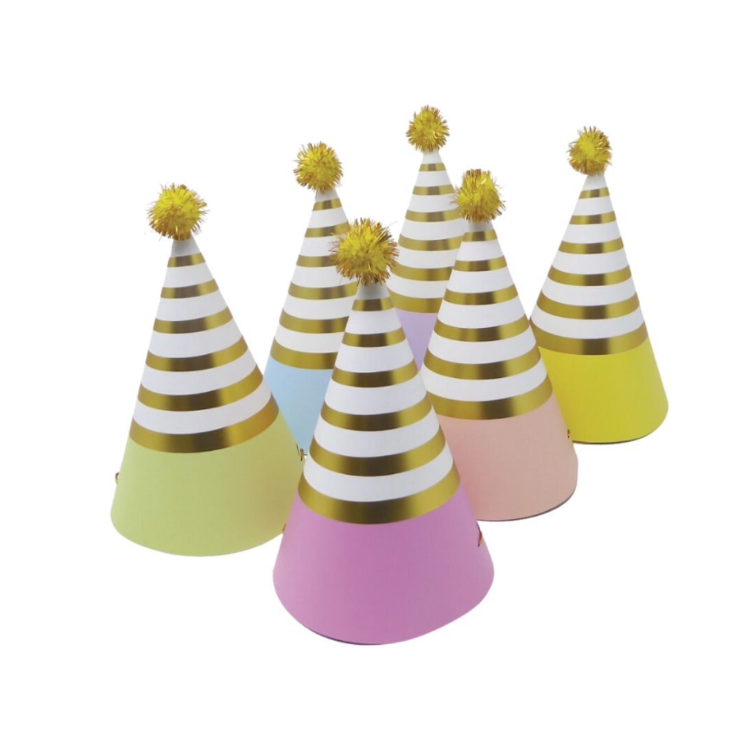 Pastel rainbow cone hats with gold stripes and pom poms birthday decor from Parte Haus party supply store in Bethesda MD
