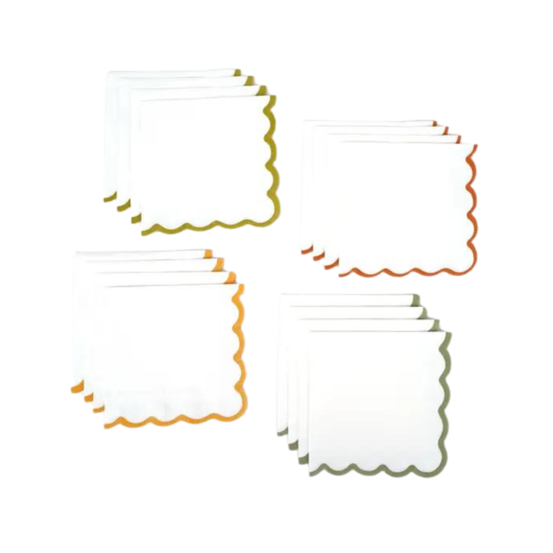 White scalloped edge napkins with gold orange and green trim for birthday from Parte Haus party supply store in Bethesda Maryland