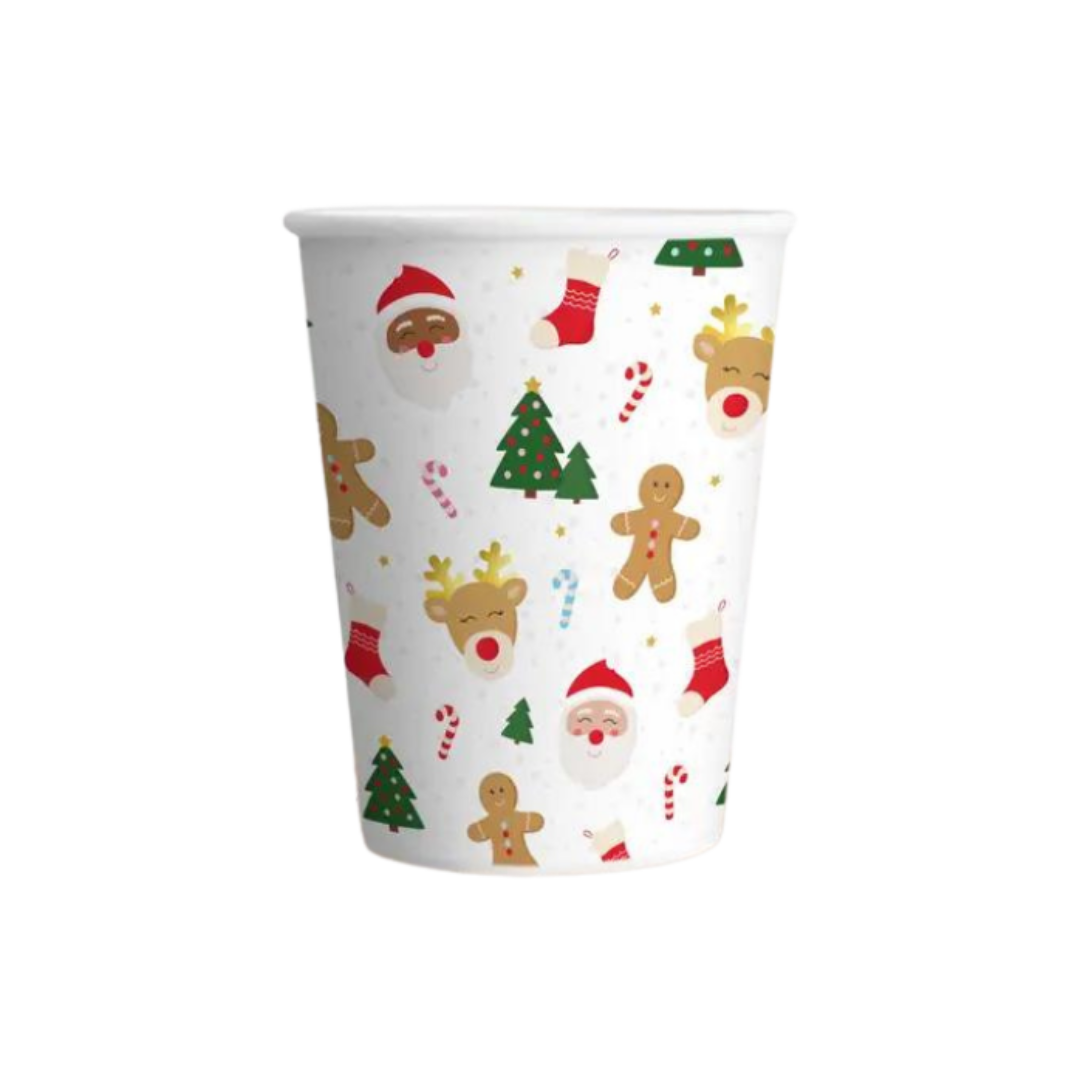 White Christmas paper cup with festive designs trees Santa and gingerbread from Parte Haus party supply store in Bethesda MD.