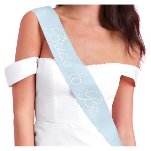 Light blue bride to be sash with white rhinestone letters for bridal shower from Parte Haus party supply store in Bethesda MD