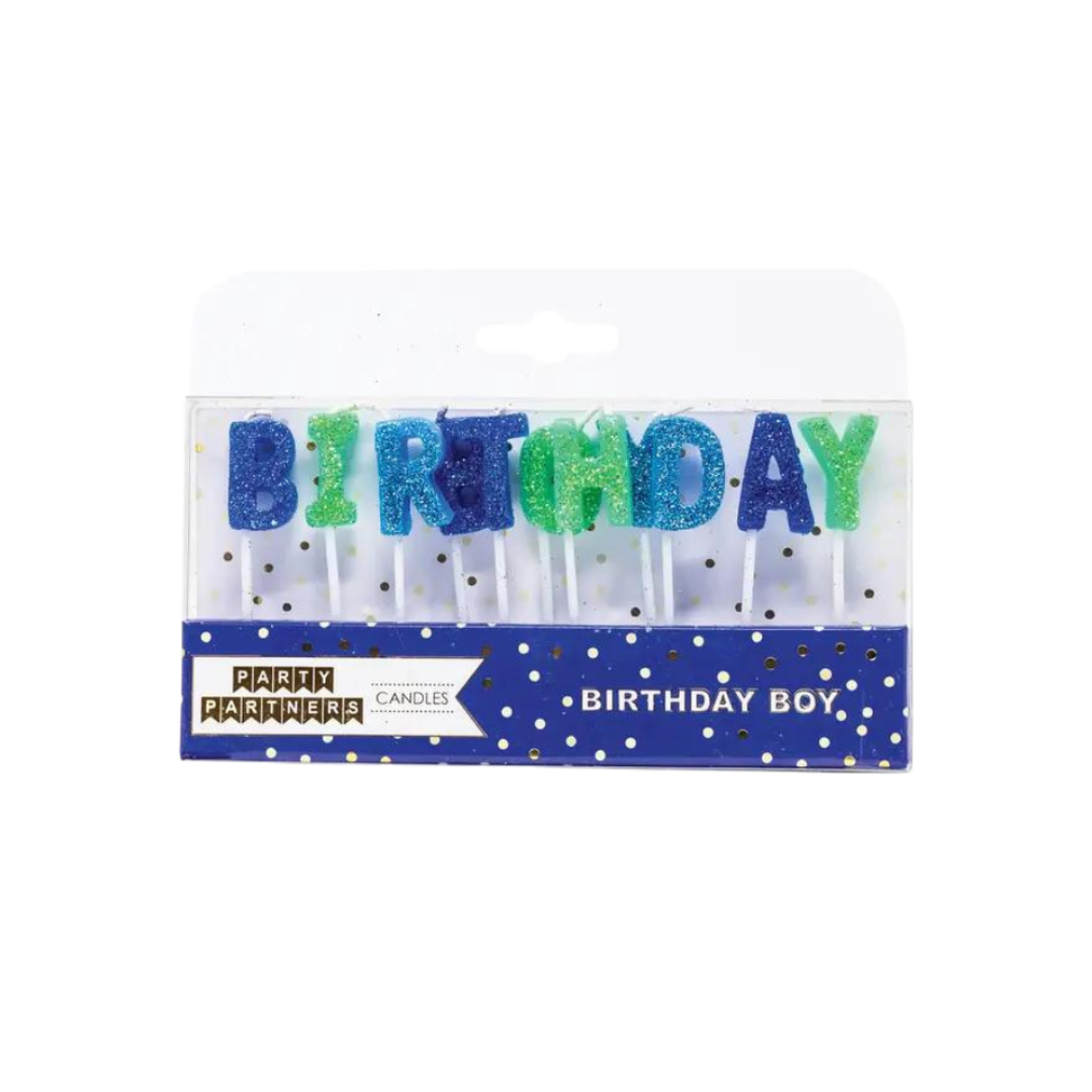 Blue and green birthday letter candles in packaging birthday boy theme from Parte Haus party supply store in Bethesda MD