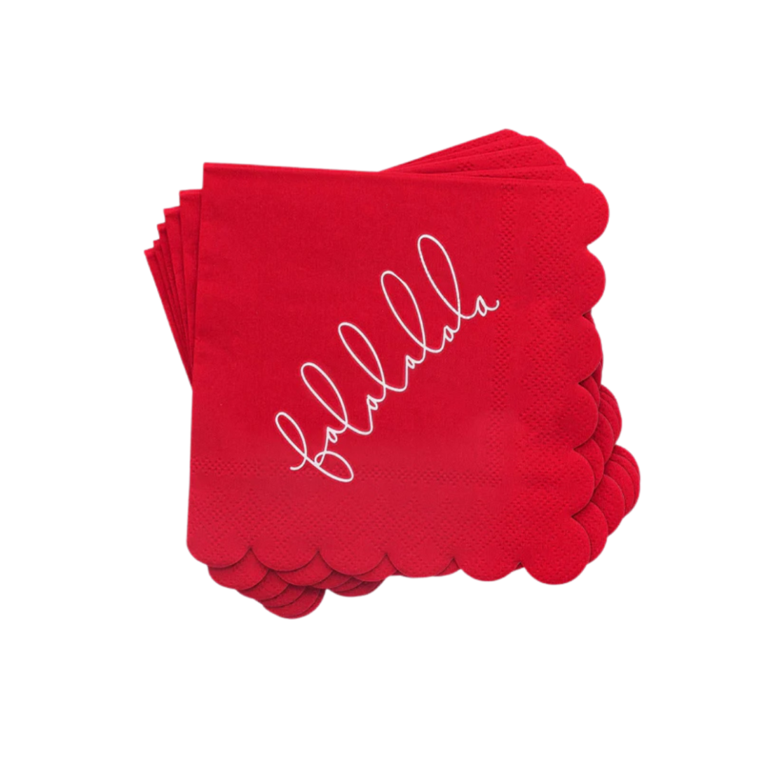 Red cocktail napkin with scalloped edges and fa la la la la script Christmas from Parte Haus party supply store in Bethesda Maryland