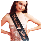 Black birthday sash with gold lettering worn by woman for birthday celebration from Parte Haus party supply store in Bethesda MD