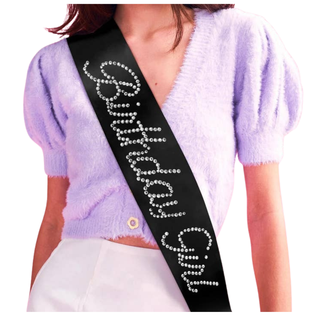Black rhinestone birthday girl sash on woman birthday celebration from Parte Haus party supply store in Bethesda MD