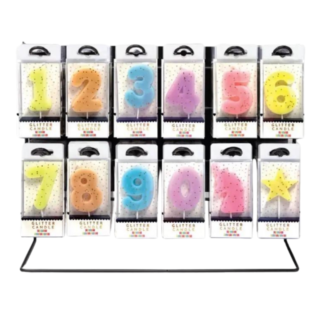 Colorful glitter number candles for birthday celebrations display from Parte Haus party supply store in Bethesda Maryland