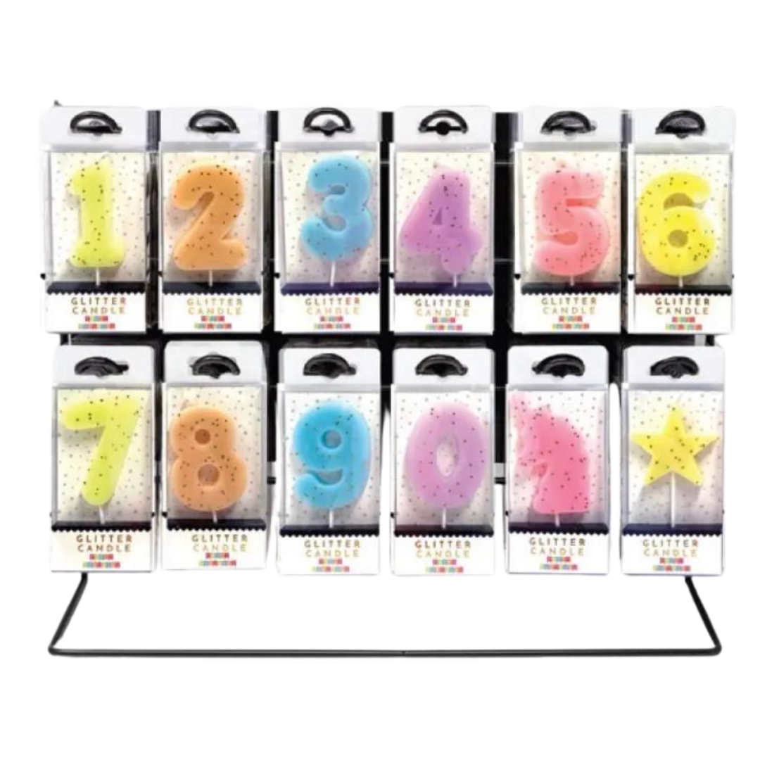 Colorful glitter number candles for birthday celebrations display from Parte Haus party supply store in Bethesda Maryland