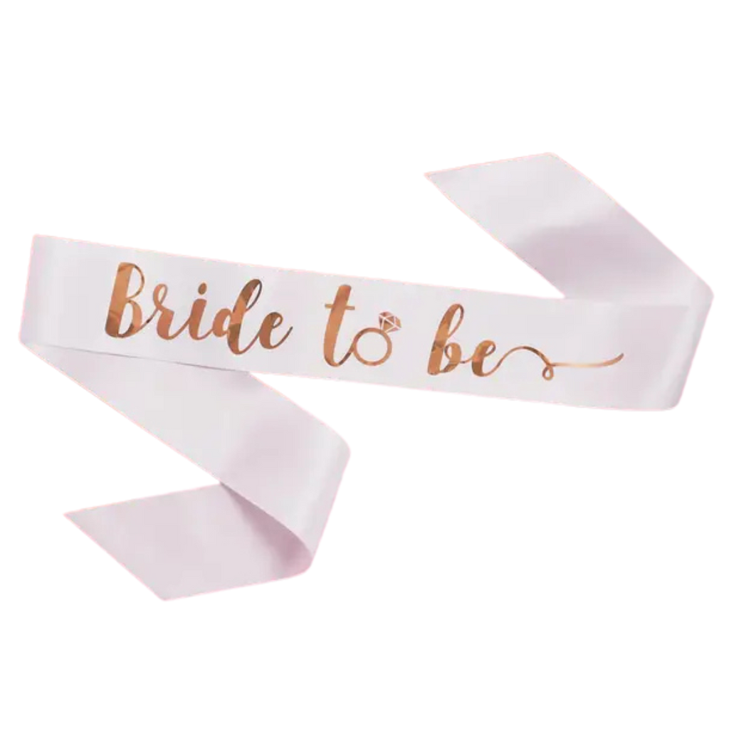 White bride to be sash with rose gold script for bridal shower from Parte Haus party supply store in Bethesda, Maryland
