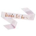 White bride to be sash with rose gold script for bridal shower from Parte Haus party supply store in Bethesda, Maryland