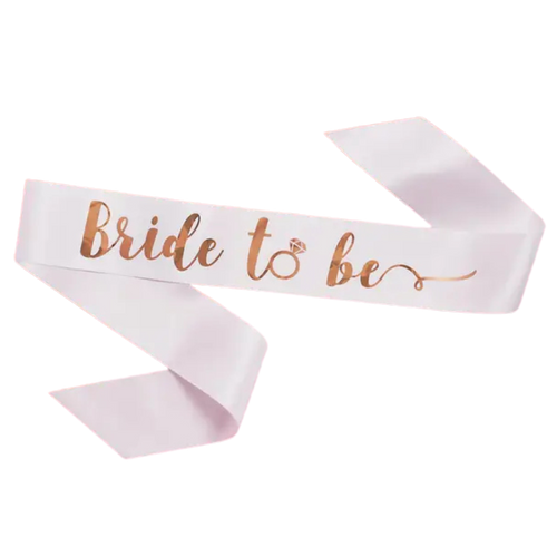 White bride to be sash with rose gold script for bridal shower from Parte Haus party supply store in Bethesda, Maryland