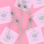 Silver reusable disco ball swirly straws on pink background bachelorette disco theme from Parte Haus party supply store in Bethesda Maryland