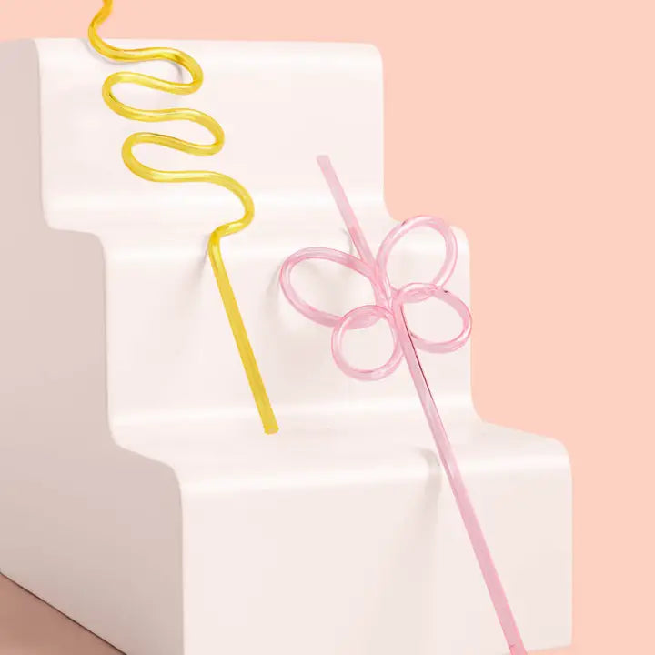 Yellow and pink reusable swirly straws with fun shapes birthday decor from Parte Haus party supply store in Bethesda MD