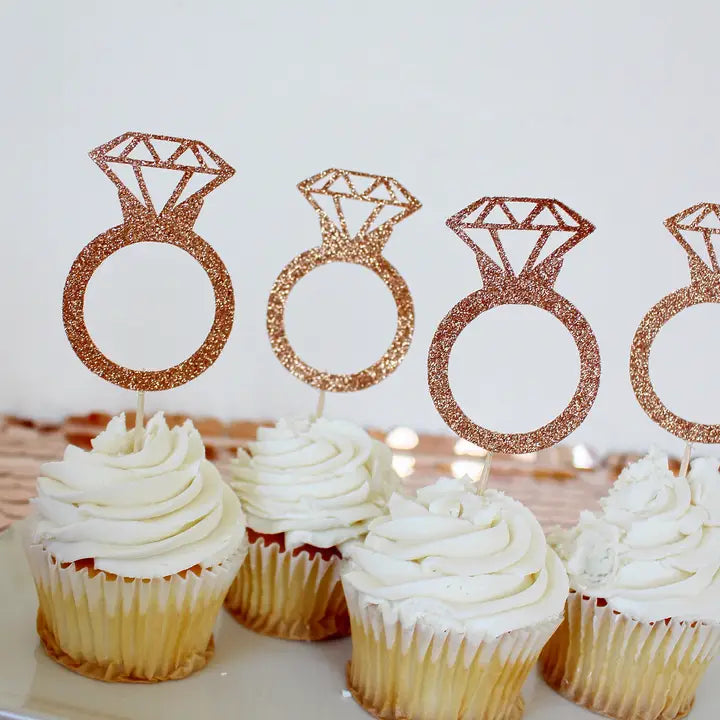 Rose gold ring cupcake toppers on white frosted cupcakes bridal shower from Parte Haus party supply store in Bethesda MD