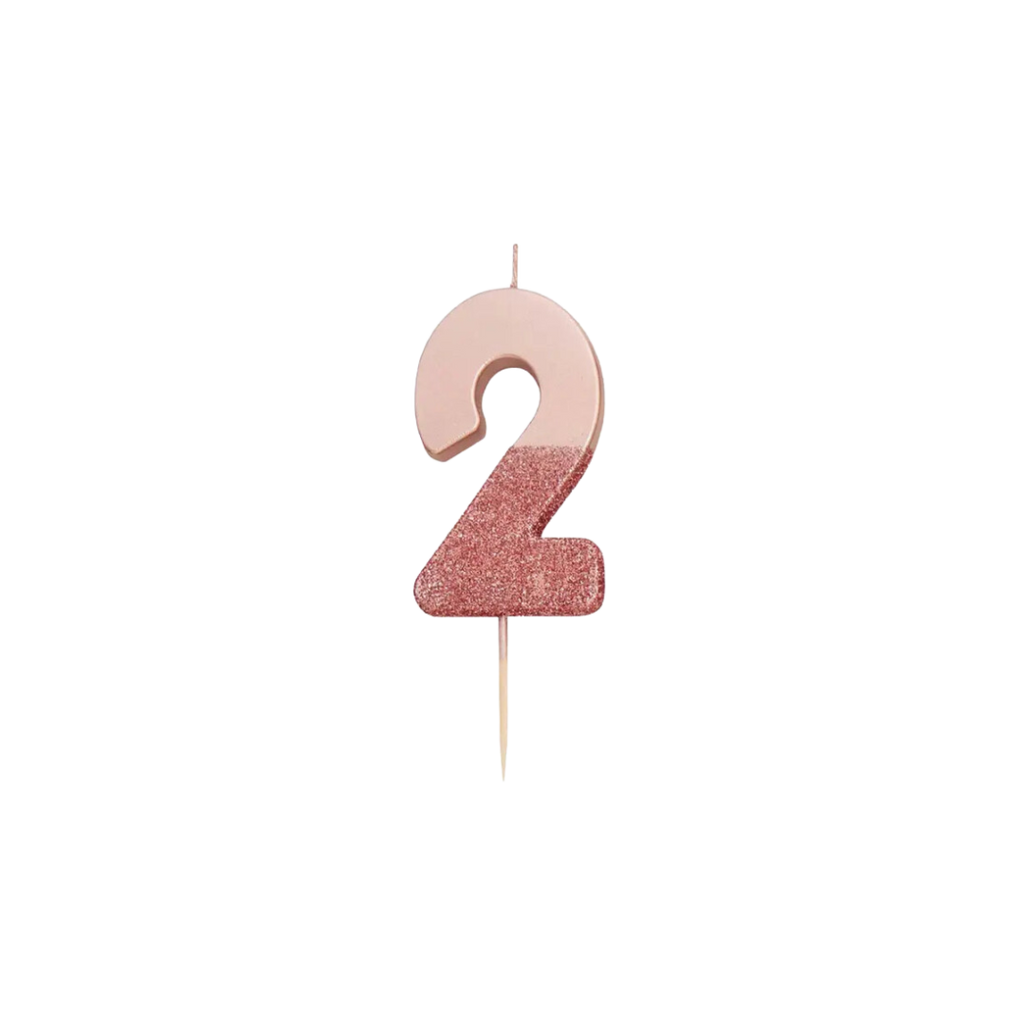Rose gold glitter number candle shaped like a 2 birthday theme from Parte Haus party supply store in Bethesda Maryland