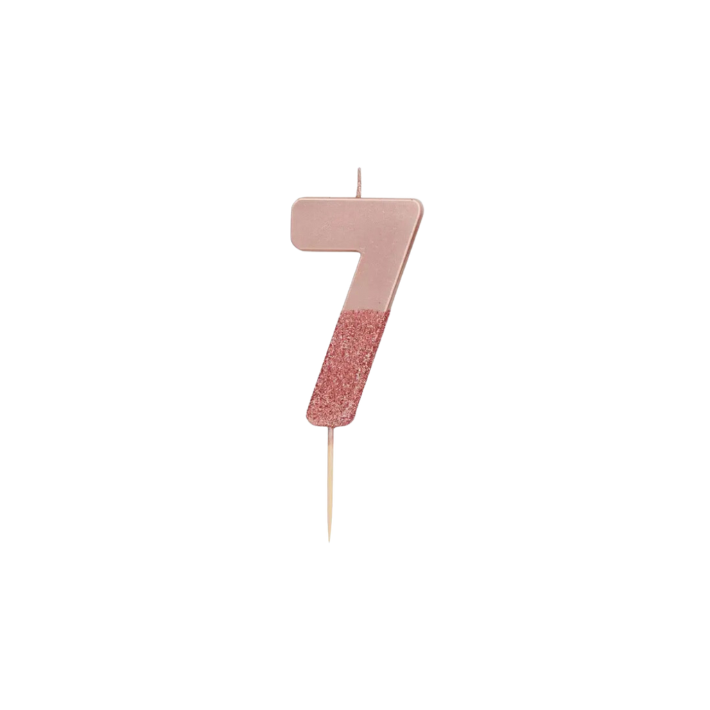 Rose gold glitter number seven candle with stick for birthday celebration from Parte Haus party supply store in Bethesda MD
