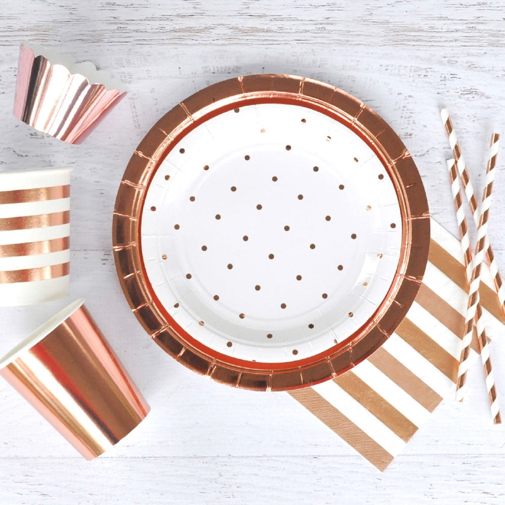 Rose gold dinner plates with polka dots modern tableware for celebration from Parte Haus party supply store in Bethesda MD