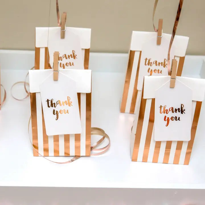 Rose gold striped treat bags with thank you tags for celebrations from Parte Haus party supply store in Bethesda MD