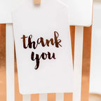 Rose gold stripes treat bag with thank you tag for celebrations from Parte Haus party supply store in Bethesda MD