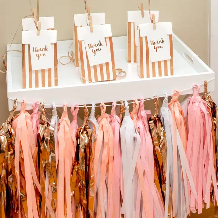 Rose gold striped treat bags with thank you labels for birthday from Parte Haus party supply store in Bethesda MD