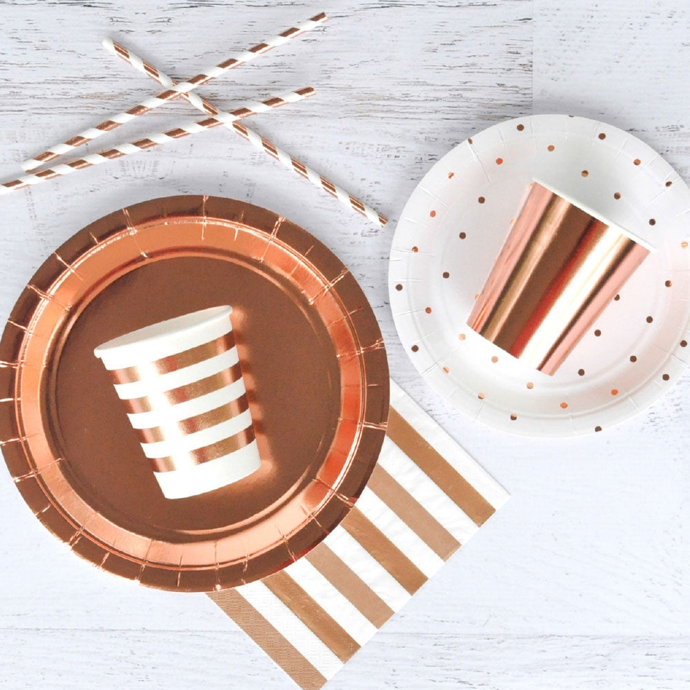 Rose gold foil cups with stripes on plates and straws birthday theme from Parte Haus party supply store in Bethesda MD