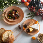 Gold plastic dinner and salad plates with gourmet food for elegant events from Parte Haus party supply store in Bethesda MD