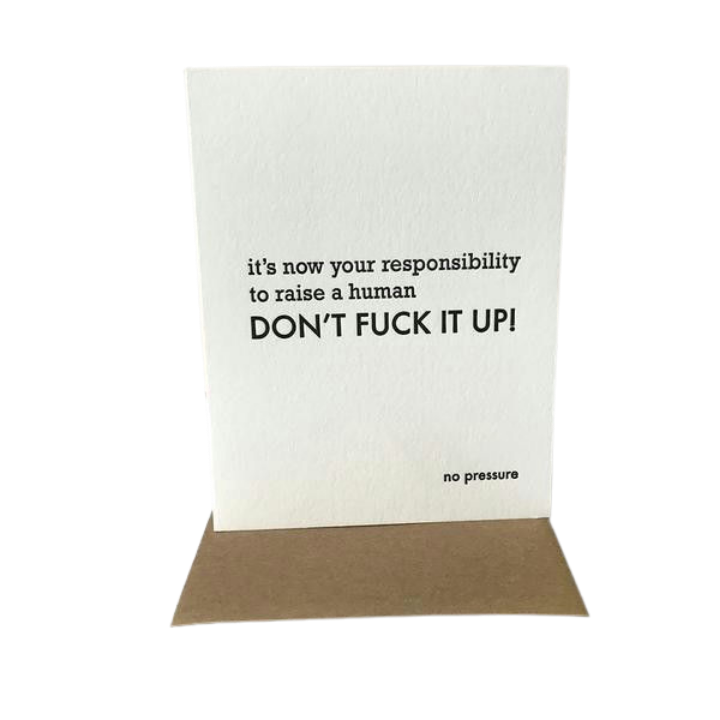 White humorous new baby card featuring bold black text from Parte Haus party supply store in Bethesda Maryland