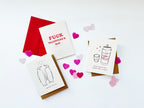 White and red Valentine greeting cards with envelopes and illustrated hearts for love from Parte Haus party supply store in Bethesda MD