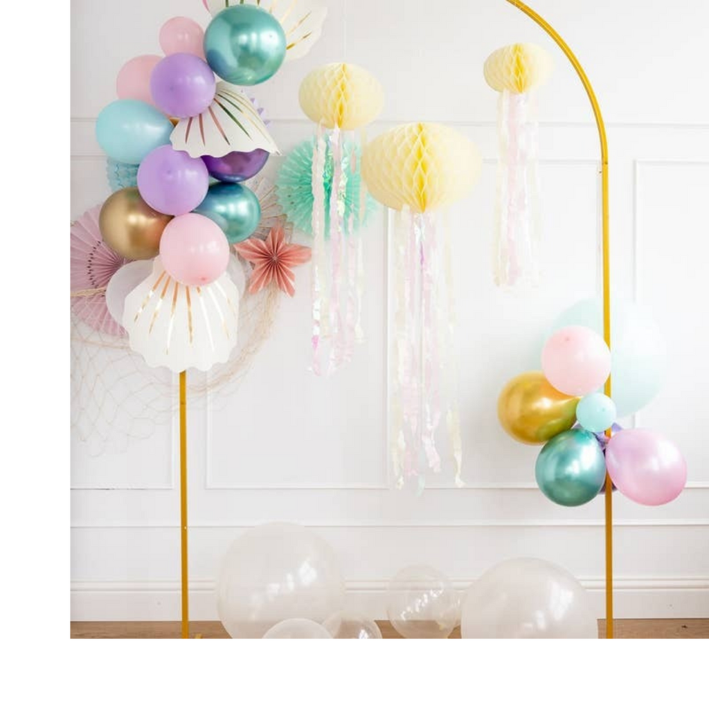 Pastel and gold mermaid balloon arch with shell accents for under the sea birthday from Parte Haus party supply store in Bethesda MD