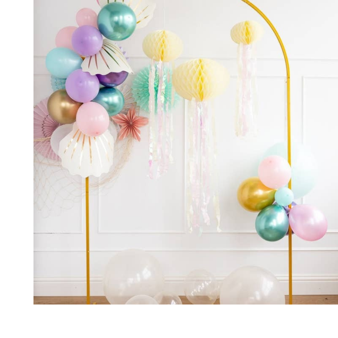 Pastel and gold mermaid balloon arch with shell accents for under the sea birthday from Parte Haus party supply store in Bethesda MD
