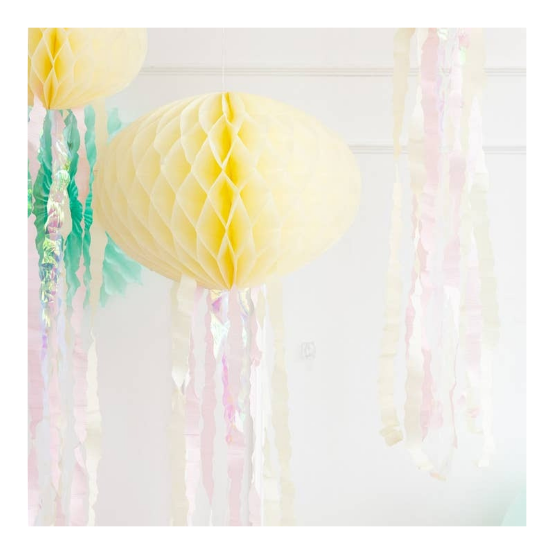 Yellow lantern honeycomb hanging decoration with pastel streamers birthday theme from Parte Haus party supply store in Bethesda MD.