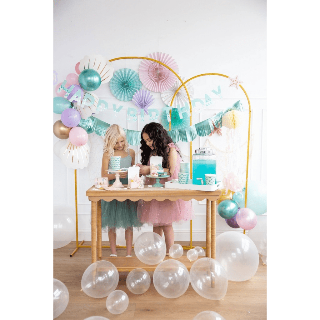Aqua and pink balloon garland mermaid birthday decor with two girls celebrating from Parte Haus party supply store in Bethesda Maryland