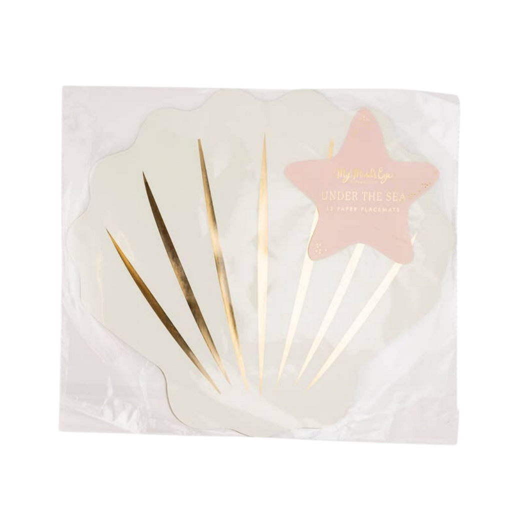 White and gold seashell paper placemat with star label under the sea theme from Parte Haus party supply store in Bethesda, MD