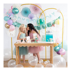 Teal and pink mermaid birthday party setup with paper fans pastel balloons and two girls from Parte Haus party supply store in Bethesda MD